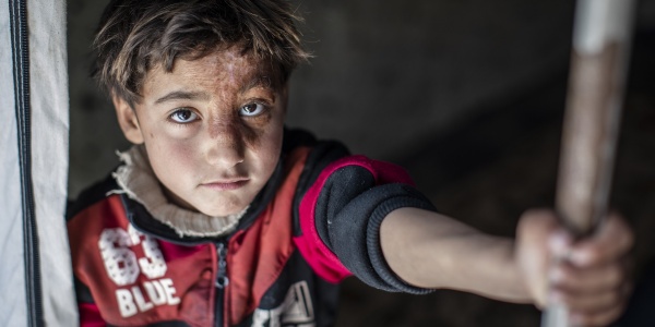 Bambino sfollato in un campo siriano